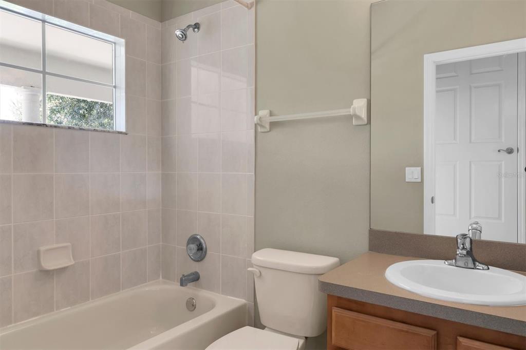 10121 Porch Street New Port Richey, FL 34655 - Photo 33 of 57 a bathroom with a sink a toilet and shower