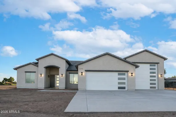 a front view of a house with yard