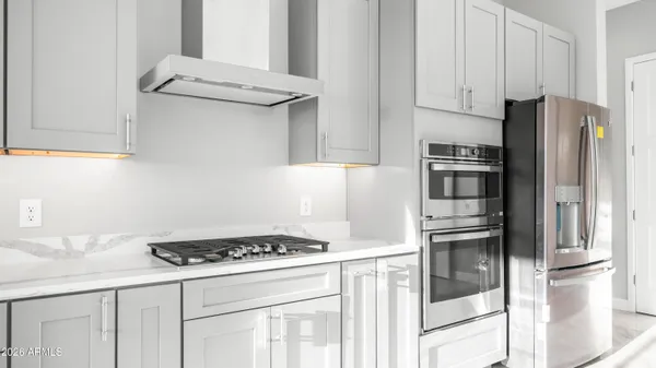 a kitchen with a sink stove and cabinets