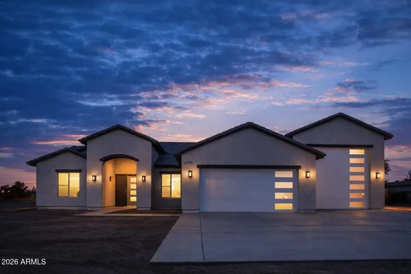 a front view of a house with yellow lighting