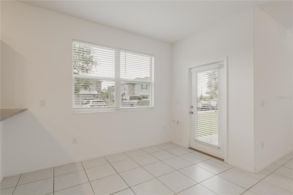 14302 Editors Note Street Ruskin, FL 33573 - Photo 23 of 44 an empty room with windows