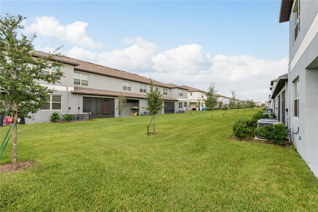 14302 Editors Note Street Ruskin, FL 33573 - Photo 34 of 44 a view of an house with backyard porch and garden