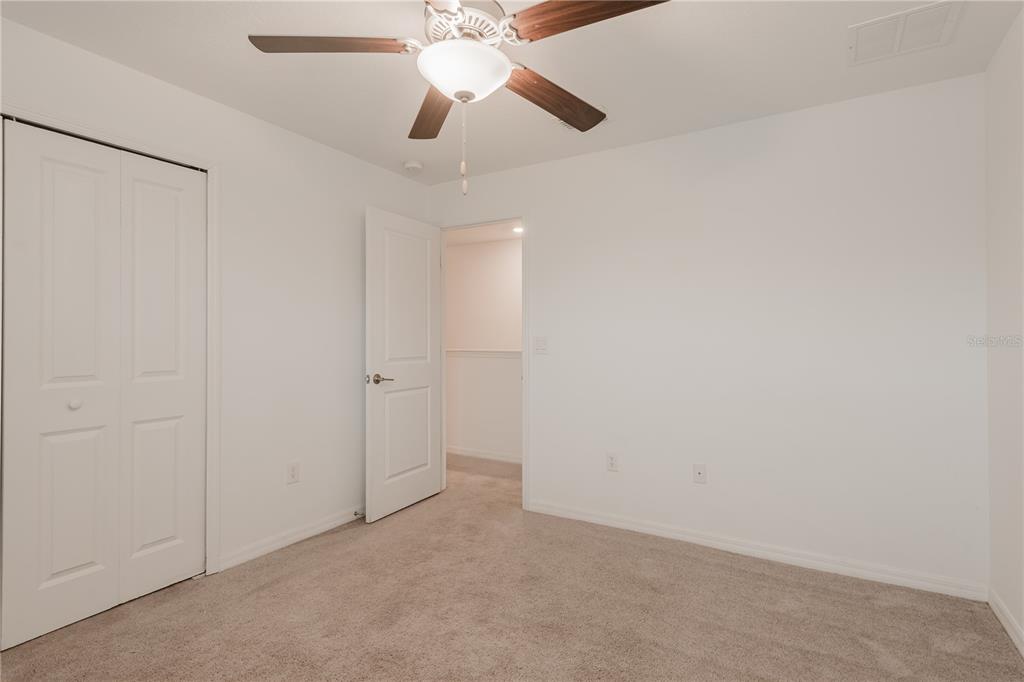14302 Editors Note Street Ruskin, FL 33573 - Photo 10 of 44 wooden floor in an empty room