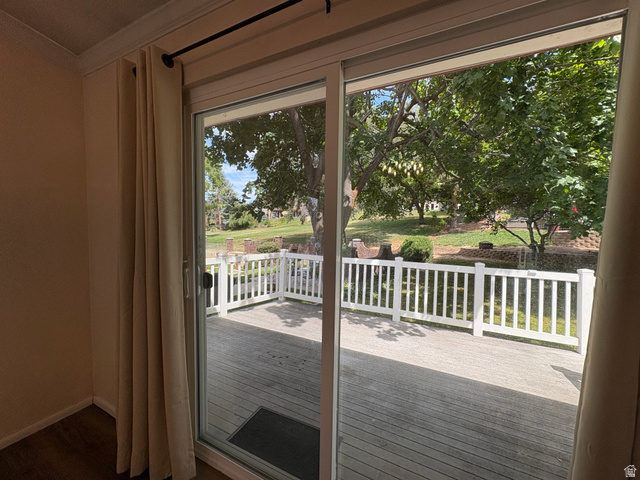 595 Meadowlark Road Orem, UT 84097 - Photo 7 of 87 Sliding glass door opening to a wood-finish deck with white railings
