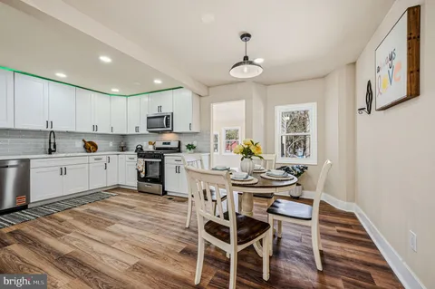 a kitchen with a sink cabinets and window