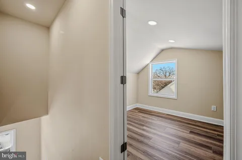 a view of a hallway to a bedroom
