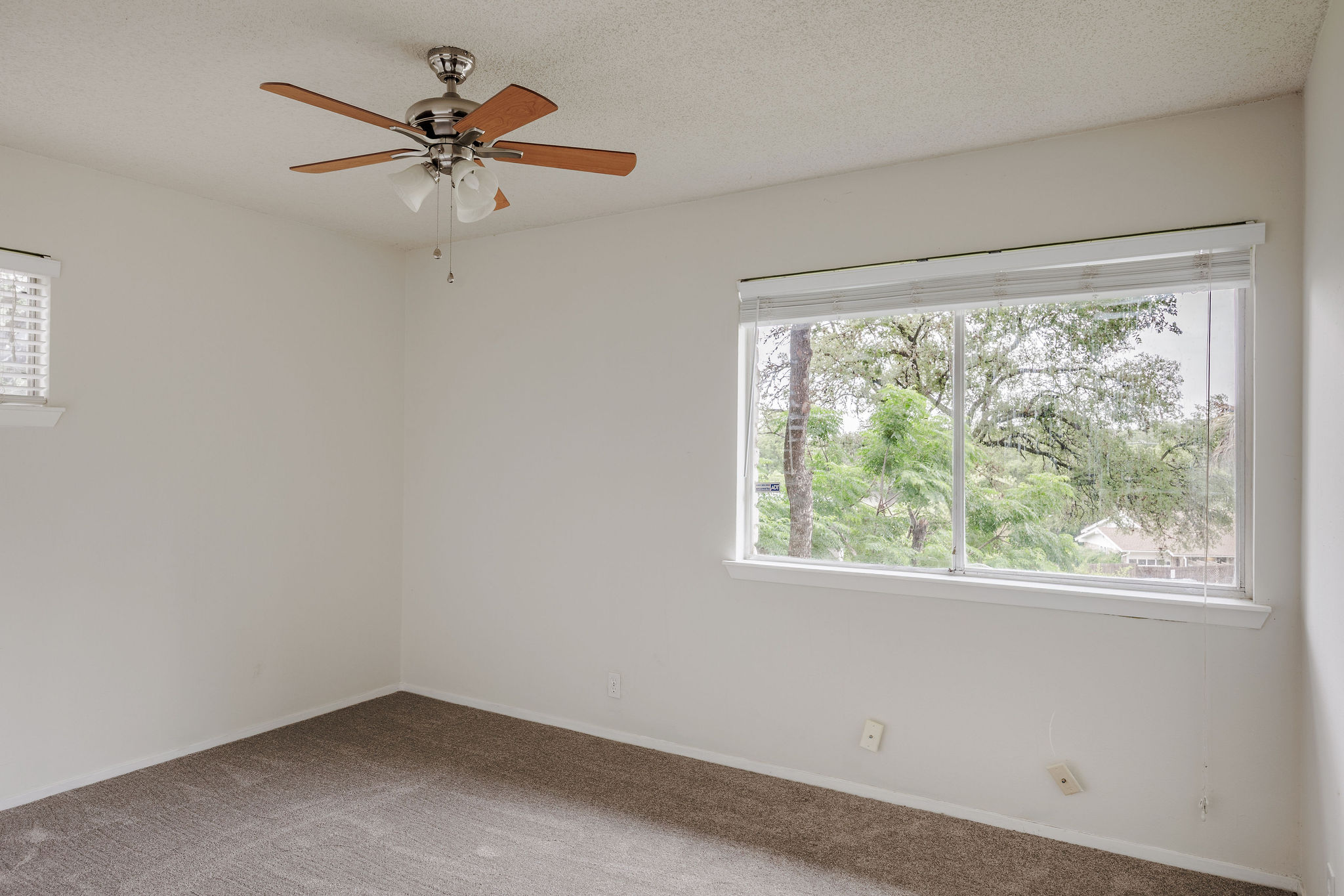 2012 Cody Court Austin, TX 78704 - Photo 27 of 40 A quiet bedroom offers comfort with a large window and ceiling fan.