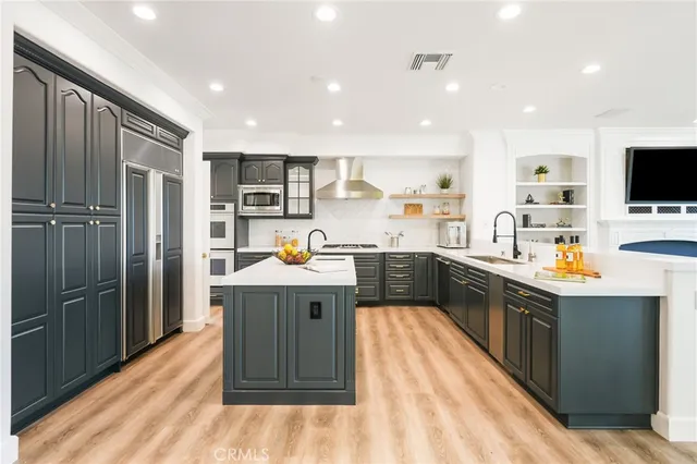 a kitchen with a refrigerator and a sink