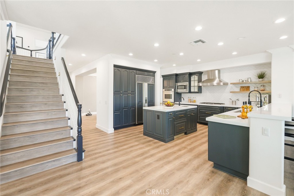 20112 Vía Cellini Porter Ranch, CA 91326 - Photo 17 of 64 a kitchen with a refrigerator and a sink