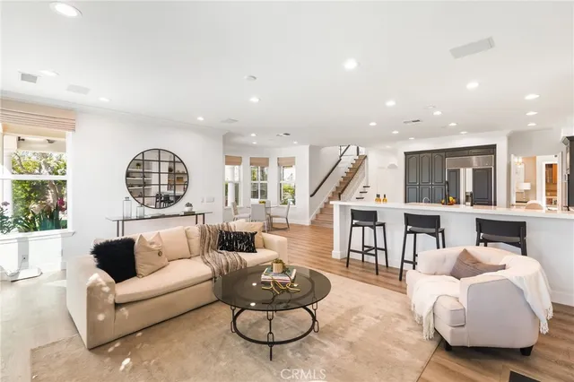 a kitchen with stainless steel appliances a sink stove and cabinets