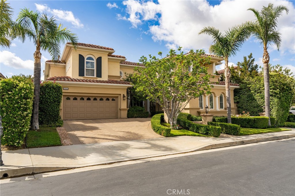 20112 Vía Cellini Porter Ranch, CA 91326 - Photo 2 of 64 a front view of a house with a yard and garage