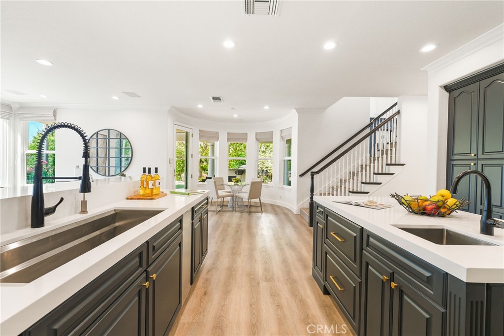 20112 Vía Cellini Porter Ranch, CA 91326 - Photo 21 of 64 a kitchen with stainless steel appliances a sink stove and cabinets
