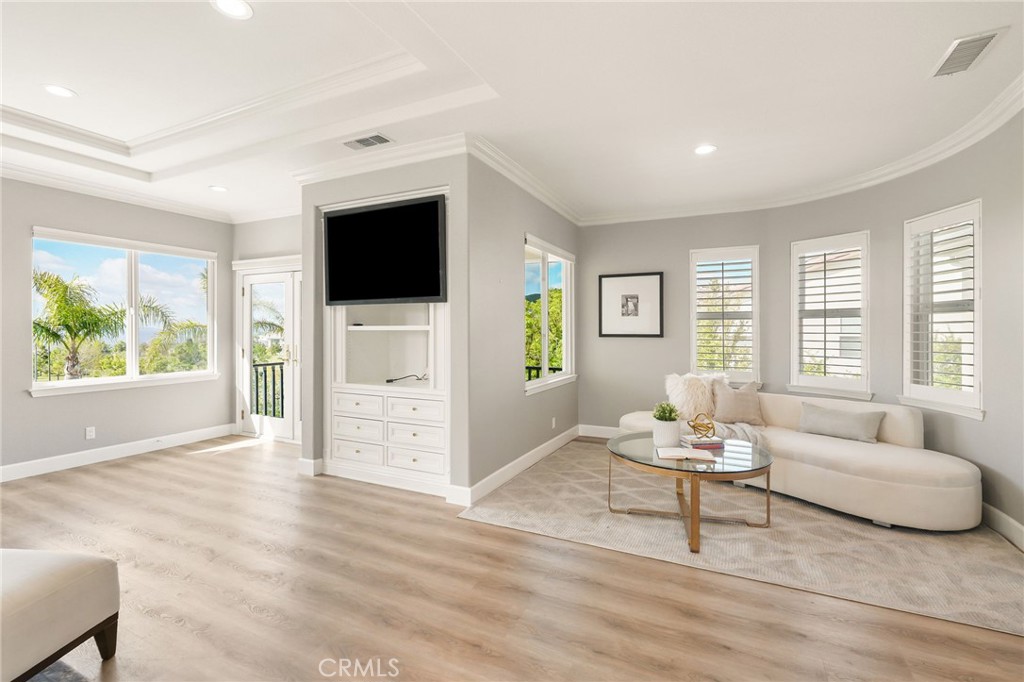 20112 Vía Cellini Porter Ranch, CA 91326 - Photo 28 of 64 a living room with furniture and a flat screen tv