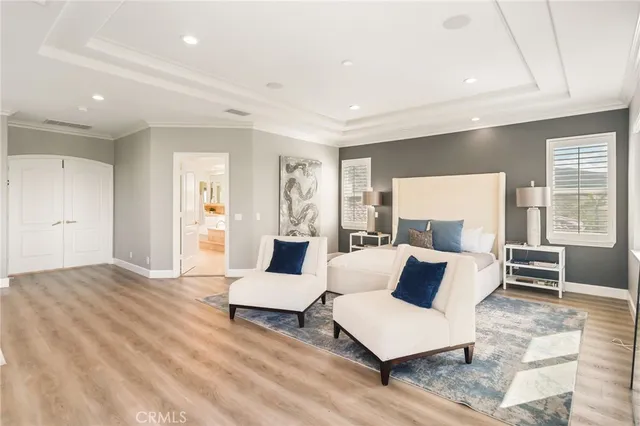 a spacious bathroom with a tub double sink and mirror