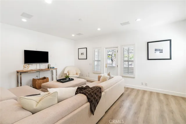 a bedroom with two beds and a couch