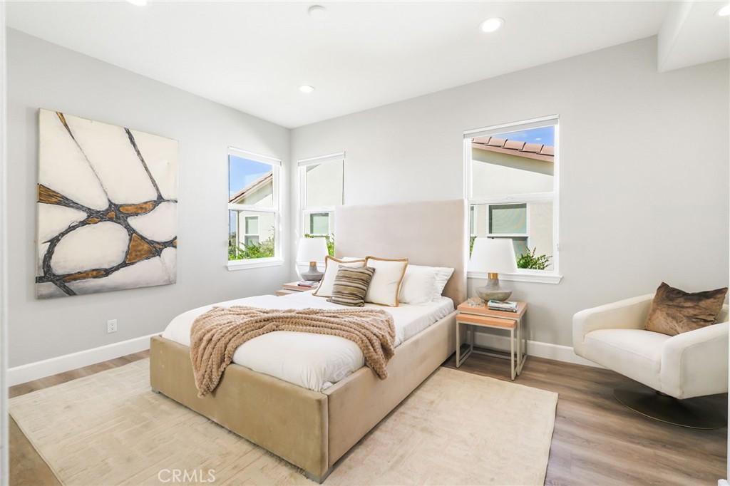 20112 Vía Cellini Porter Ranch, CA 91326 - Photo 38 of 64 a bedroom with a bed and window