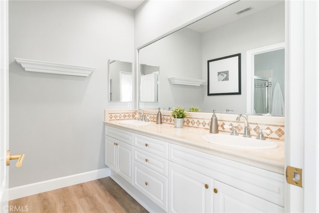 20112 Vía Cellini Porter Ranch, CA 91326 - Photo 41 of 64 a bathroom with a sink and a mirror