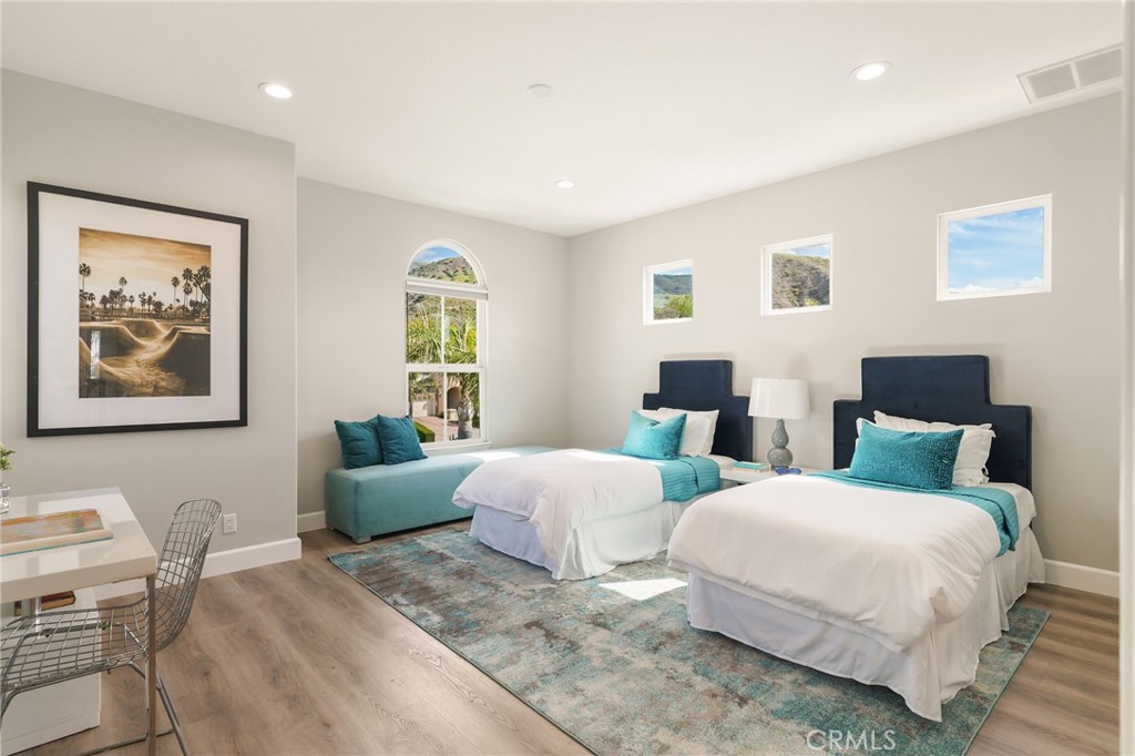 20112 Vía Cellini Porter Ranch, CA 91326 - Photo 42 of 64 a bedroom with two beds and a couch