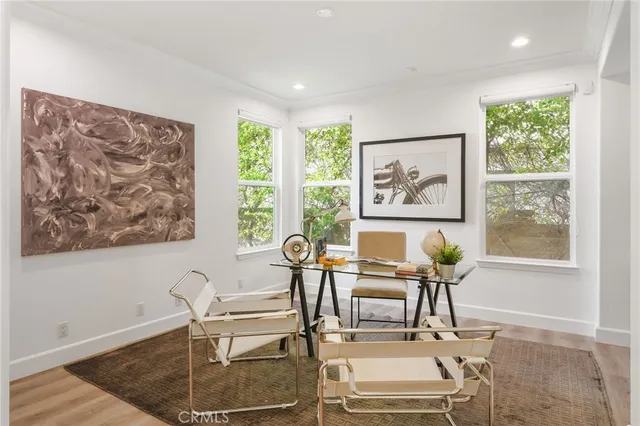 a view of a house with swimming pool and sitting area