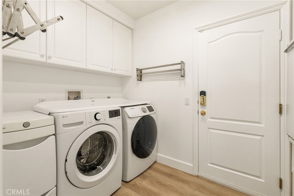 20112 Vía Cellini Porter Ranch, CA 91326 - Photo 50 of 64 a utility room with dryer and washer