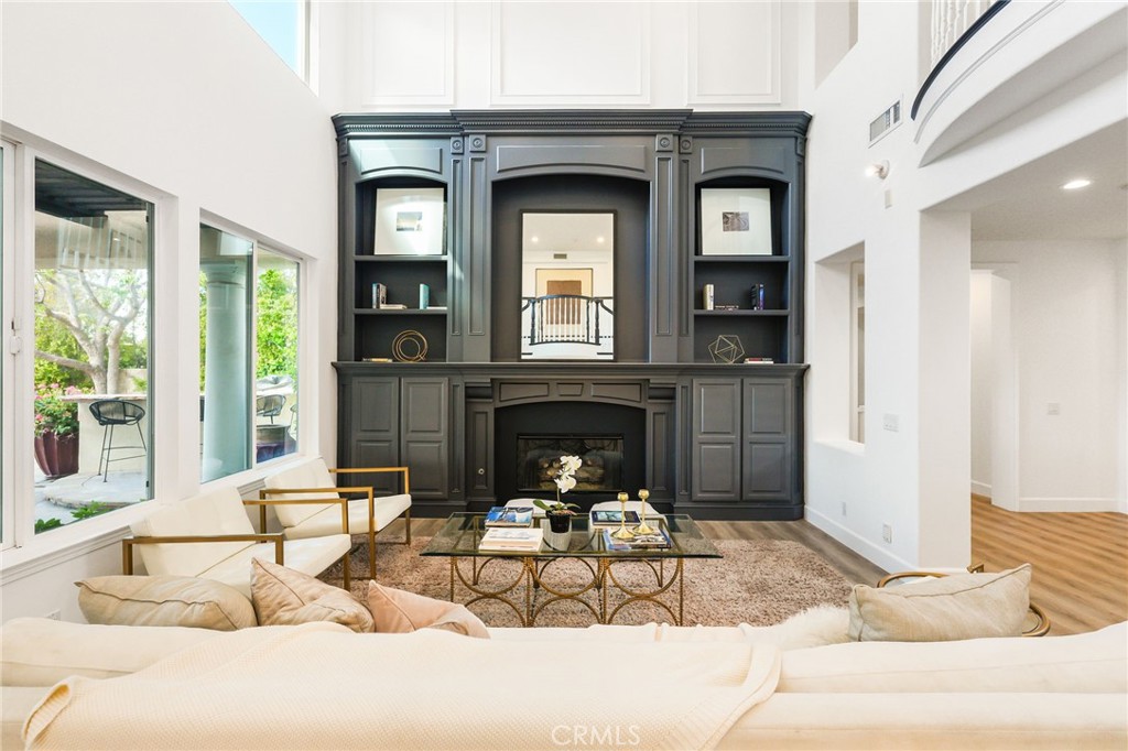 20112 Vía Cellini Porter Ranch, CA 91326 - Photo 5 of 64 a living room with furniture a fireplace and a large mirror