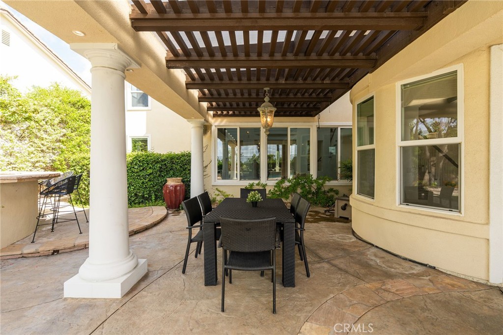 20112 Vía Cellini Porter Ranch, CA 91326 - Photo 60 of 64 a view of a patio with a table and chairs