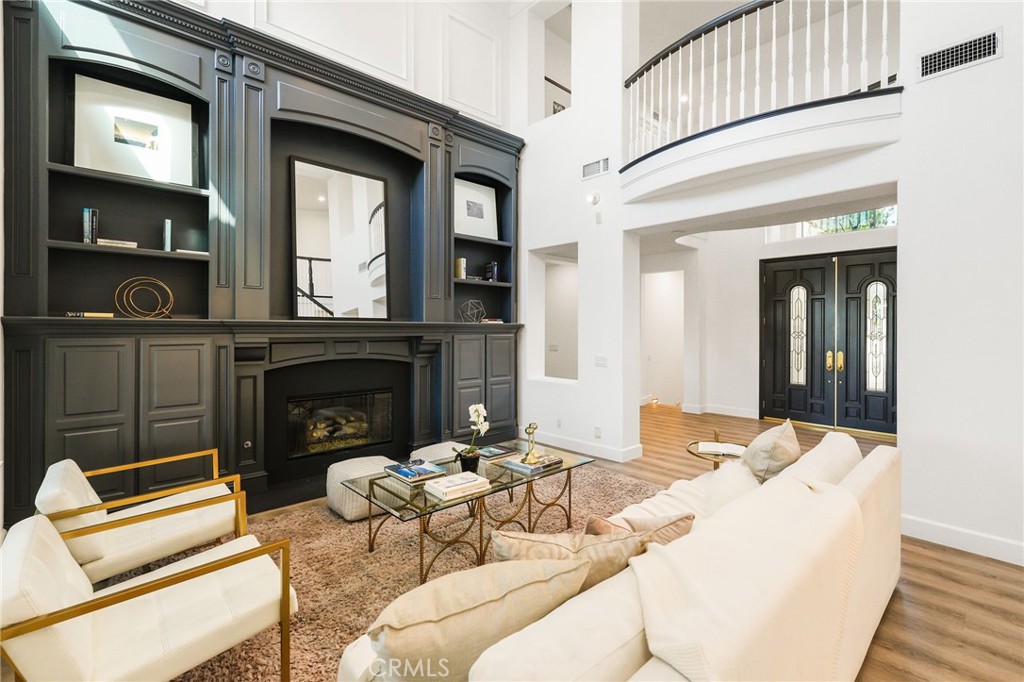 20112 Vía Cellini Porter Ranch, CA 91326 - Photo 6 of 64 a living room with furniture and a fireplace