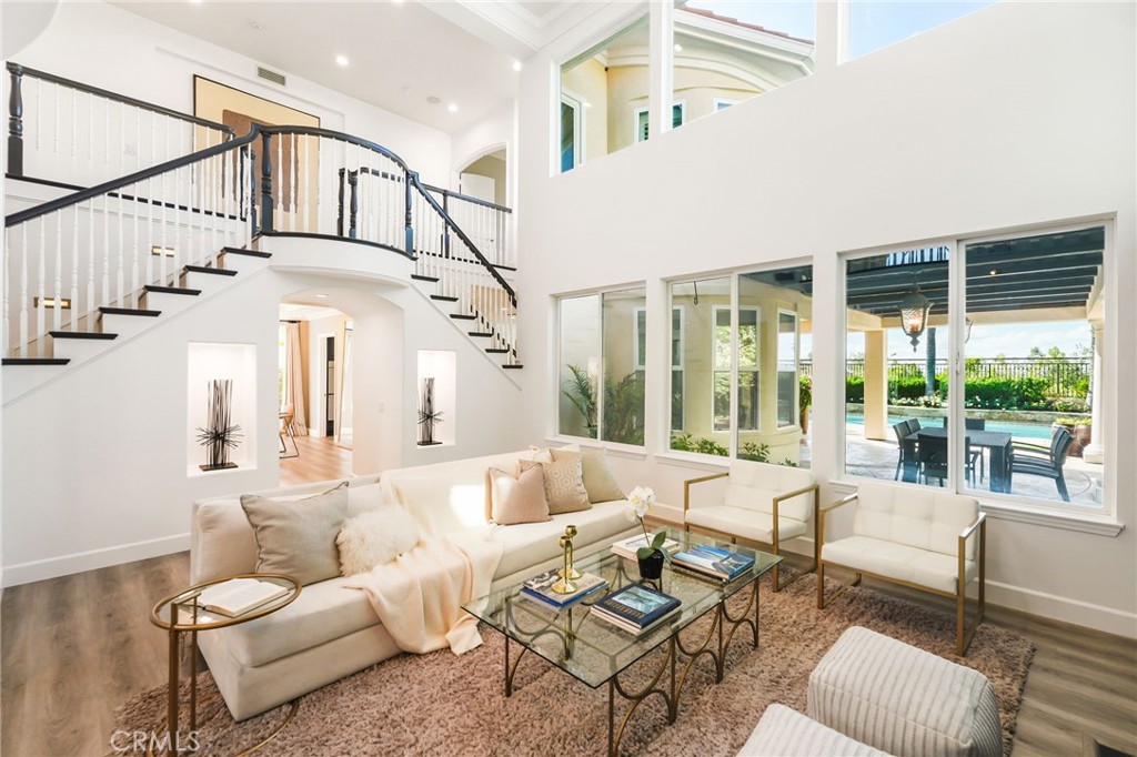 20112 Vía Cellini Porter Ranch, CA 91326 - Photo 7 of 64 a living room with patio furniture and a large window