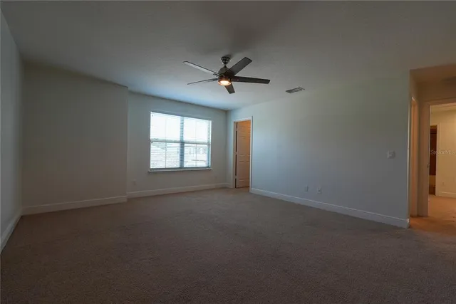 a view of a room with rack on the wall and a window
