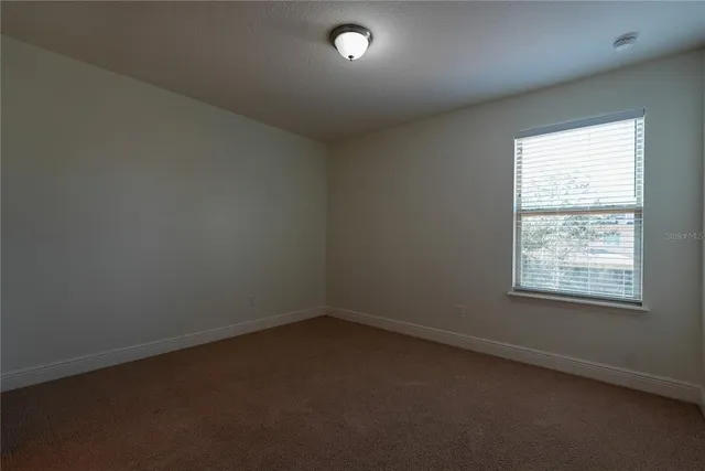a bathroom with a sink a toilet a tub and shower