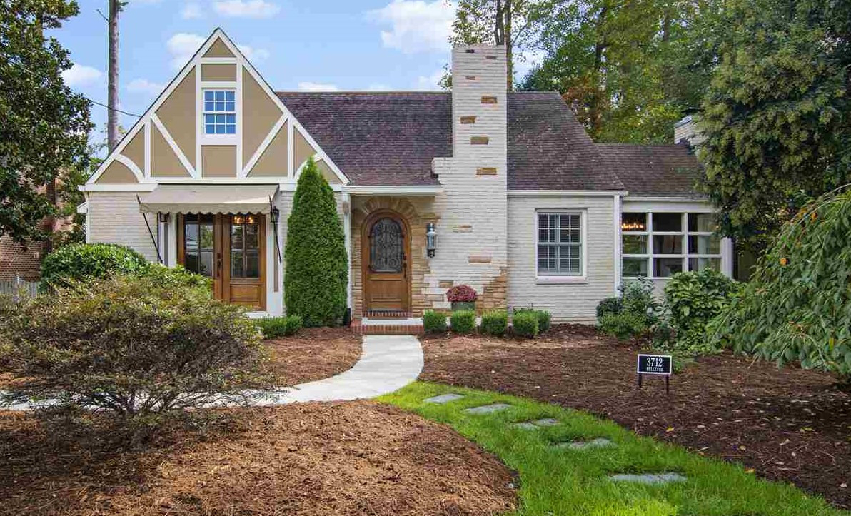3712 Bellevue Road Raleigh, NC 27609 - Photo 1 of 30 This precious English cottage home was remodeled in 2015. The Tudor style arched door is accented with wrought iron. Handsome brick with stone accents are a nice touch. The patio is off of the dining room and there is a decorative stoop at the front door. Exterior Front