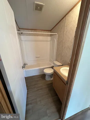 an empty room with window and entrance