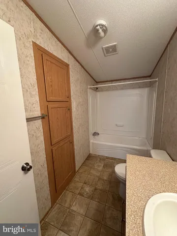 a view of a hallway view with wooden floor