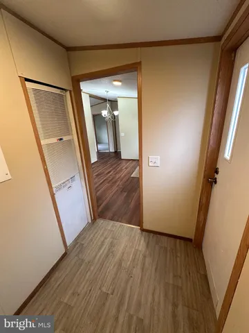 wooden floor in an empty room with a fireplace