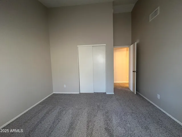 a view of an empty room and fire place