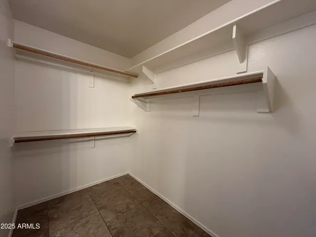 a view of an empty walk in closet