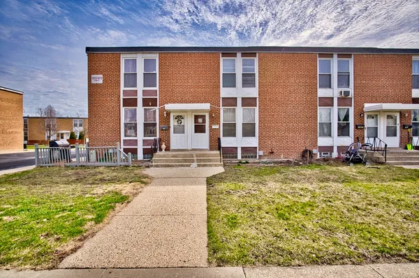 front view of a building with a yard