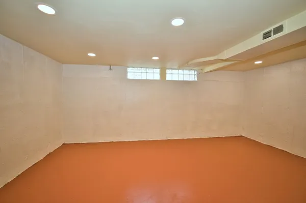 a view of a room with wooden walls