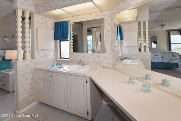 a bathroom with a double vanity sink and mirror