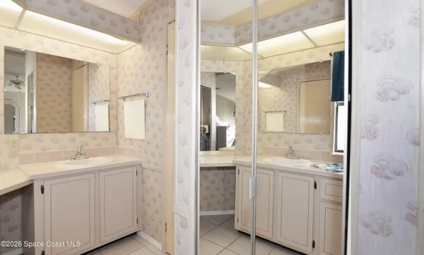 a white toilet sitting next to a bathroom sink