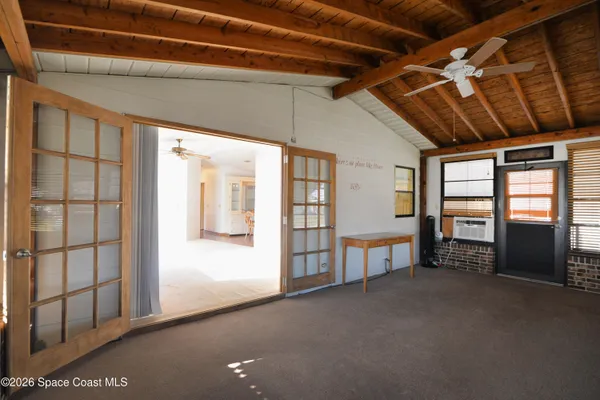 a view of an empty room with a balcony