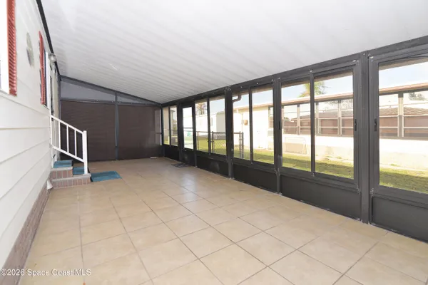 a view of a city from a corridor