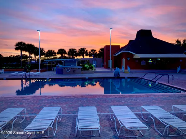 a lake view with a swimming pool