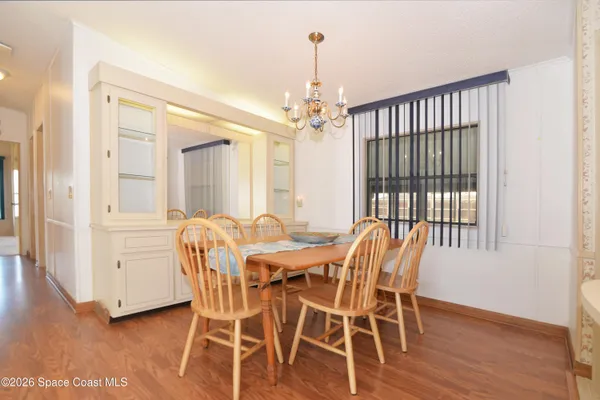 a view of a dining room with furniture and window