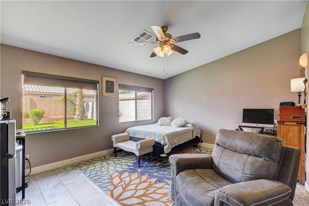 910 Cobblestone Cove Road North Las Vegas, NV 89081 - Photo 11 of 30 Natural light streams into this generously proportioned room through ample windows, creating a peaceful retreat.