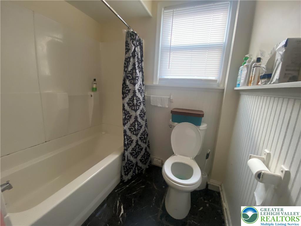 926 Butler Street Easton, PA 18042 - Photo 5 of 6 a bathroom with a toilet and a shower