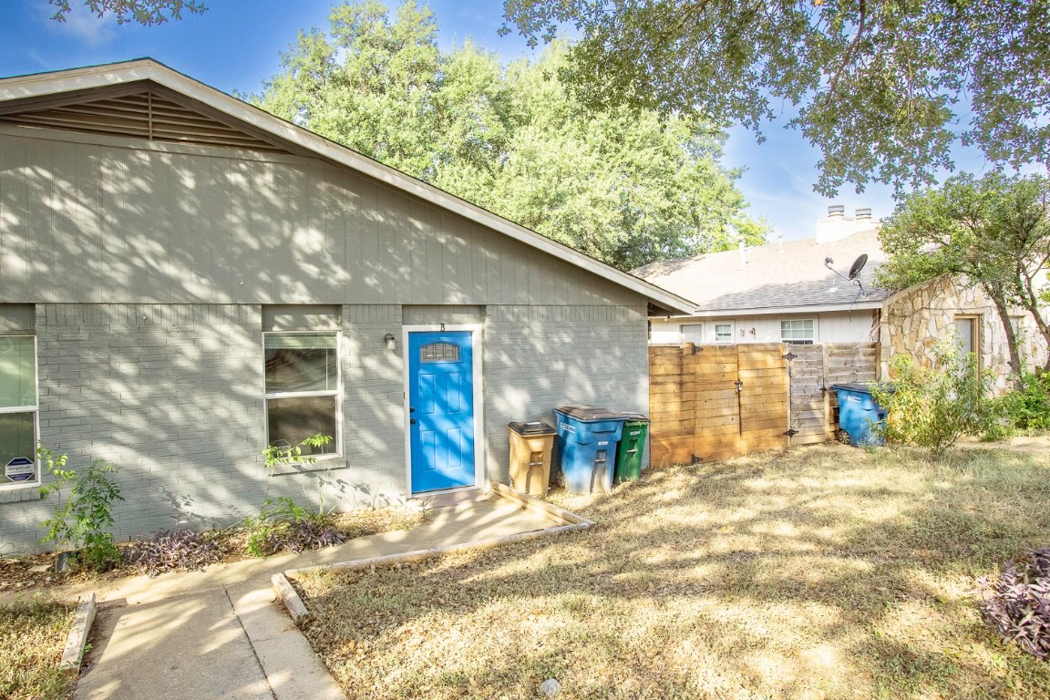 2003 Conestoga Trail, Unit B Austin, TX 78744 - Photo 2 of 18 a view of a house with backyard