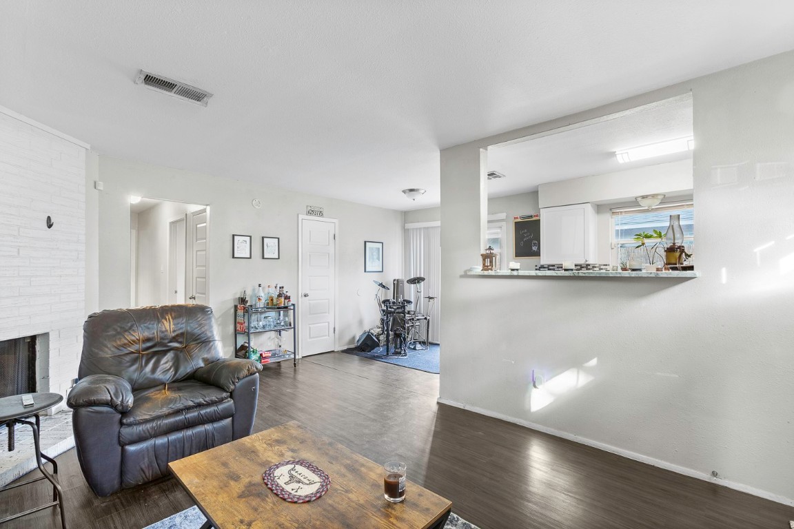 2003 Conestoga Trail, Unit B Austin, TX 78744 - Photo 5 of 18 a living room with furniture and wooden floor