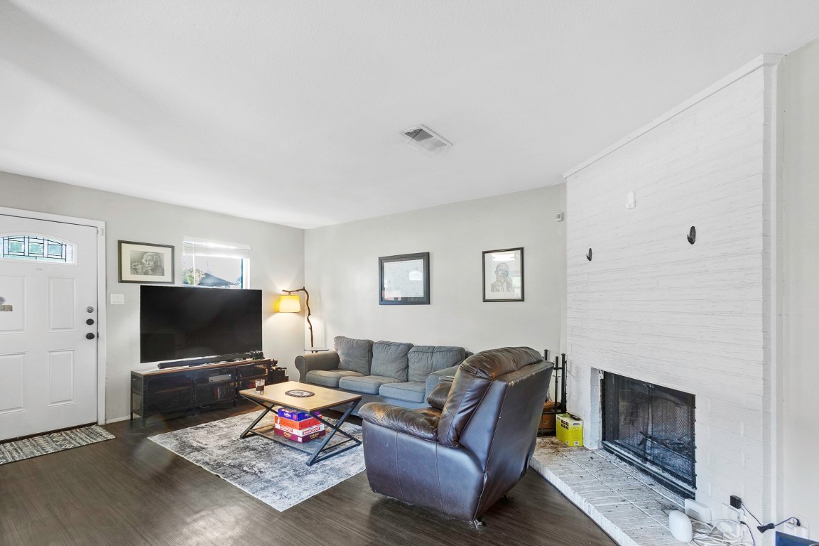 2003 Conestoga Trail, Unit B Austin, TX 78744 - Photo 6 of 18 a living room with furniture and a flat screen tv