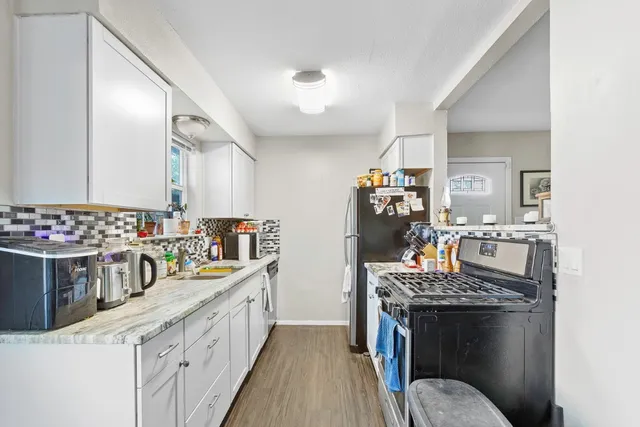 a kitchen with a stove and a sink